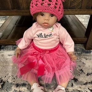 Baby Reborn doll with lot of baby clothes. (Bin not included)